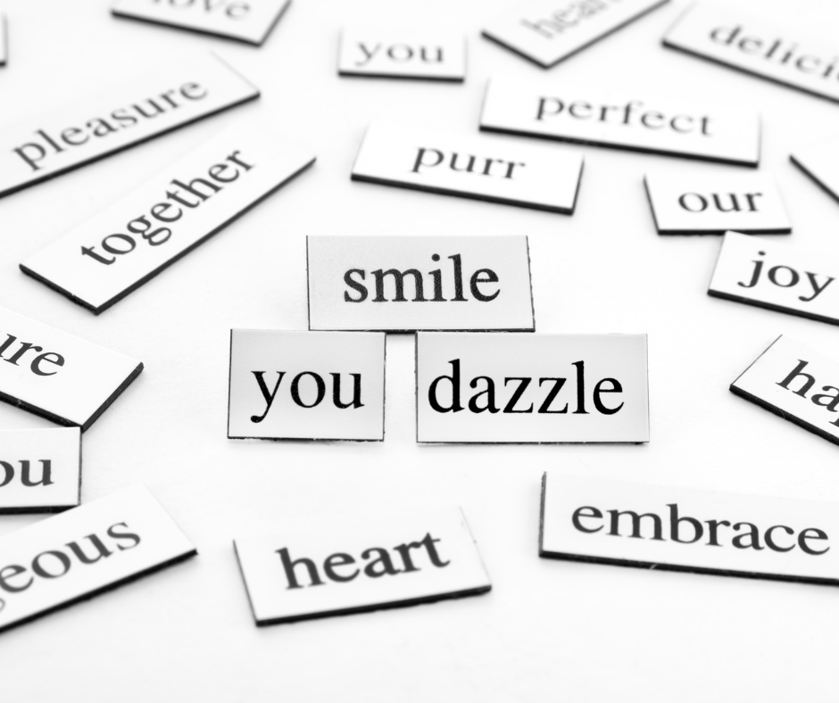 Magnetic tiles with words on them read: smile you dazzle